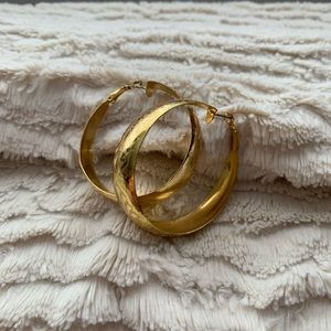 Gold hoop earrings with detailing